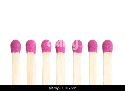 Close-up view of matchsticks lined in a row against white background. Stock Photo