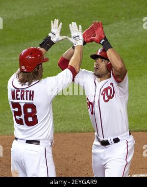 Washington Nationals' Ian Desmond gets his grip on his bat during the  seventh inning of an interleague baseball game against the Chicago White  Sox at Nationals Park ,Wednesday, April 10, 2013, in