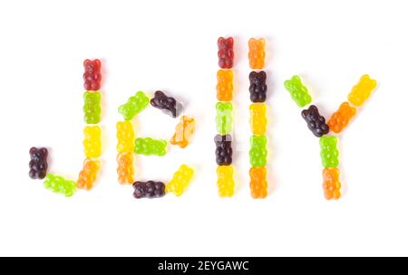 Word JELLY made of multicolored gummy bears arranged on a white background. Stock Photo