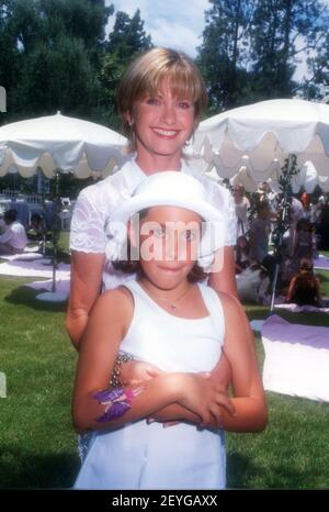 Los Angeles, California, USA 11th May 1996 Singer Olivia Newton-John and daughter Chloe Rose Lattanzi attend Picnic on the Green to Benefit CHEC (Commonwealth Human Ecology Council) at Home of Producer Alan Ladd Jr. on May 11, 1996 in Los Angeles, California, USA. Photo by Barry King/Alamy Stock Photo Stock Photo
