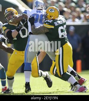 Green Bay Packers center Evan Dietrich-Smith (62) provides pass protection  for quarterback Aaron Rodgers during the second quarter of their game  against the Tennessee Titans at Lambeau Field on Sunday, December 23