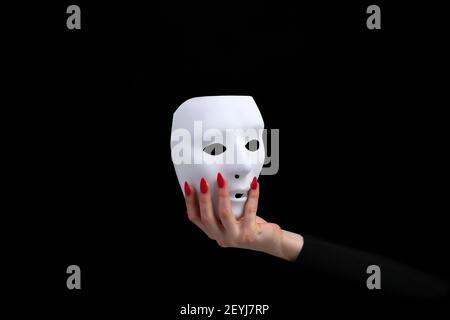 Mask is a symbol of duplicity removable after work in corporations Stock Photo