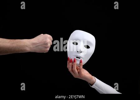 Mask is a symbol of duplicity removable after work in corporations Stock Photo