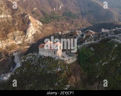 Aerial sunset view of ruins of Medieval Asen's Fortress, Asenovgrad, Plovdiv Region, Bulgaria Stock Photo