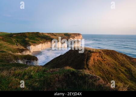 Environmental erosion along the chalk cliffs by sea, wind and weather viewed at dawn, Flamborough, Yorkshire, UK. Stock Photo