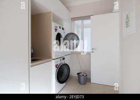 Lagos, Portugal; October 2020: Domestic utility room with LG washing machine and dryer Stock Photo