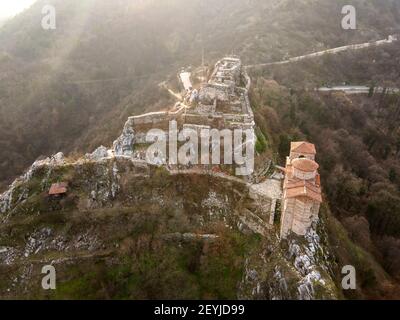 Aerial sunset view of ruins of Medieval Asen's Fortress, Asenovgrad, Plovdiv Region, Bulgaria Stock Photo