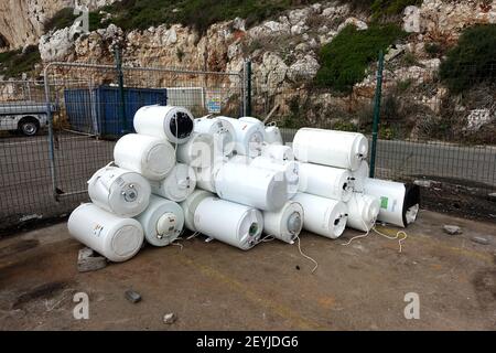 Gibraltar 09 November 2020: Lots of broken and old water heaters at the local rubbish dump Stock Photo