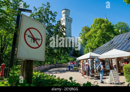 "No Drone Zone"-sign in front of the famous 19th century romantic eclecticism palace Neuschwanstein Castle in Füssen, Bavaria, Germany, Europe Stock Photo