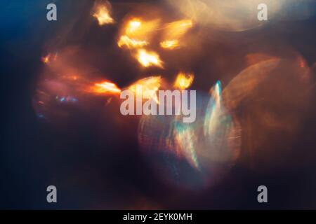 Defocused lens flare sparkling and glowing in the dark Stock Photo