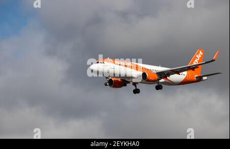 Oporto, Portugal - July 27, 2019: OE-IJA EasyJet Europe Airbus A320-214 in the air over Oporto airport Easyjet is a low cost airplane carrier.