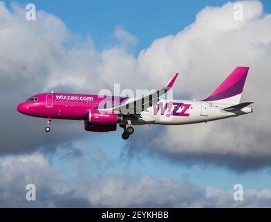Oporto, Portugal - July 27, 2019: HA-LWX Wizz Air Airbus A320-200 in the air over Oporto airport Stock Photo