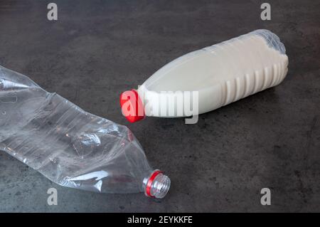 Squashed Container milk bottle squashed Stock Photo - Alamy