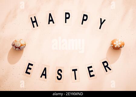 Minimalistic Easter composition. Retro style text. Top view. Flat lay Stock Photo