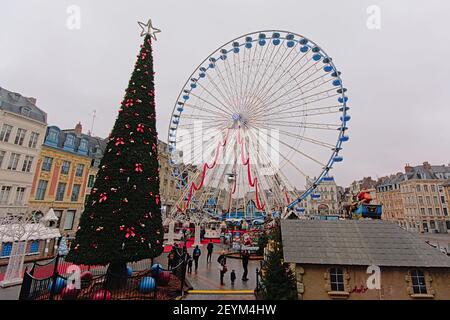 Big christmas tree and ferris wheel in Lille, france Stock Photo