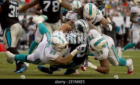 Miami Dolphins defensive tackle Jared Odrick (98) drinks Gatorade