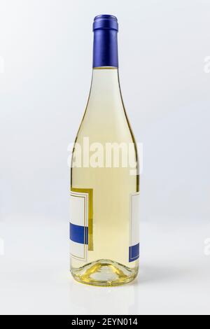 Beautiful burgundy style bottle of white wine on white surface and background Stock Photo