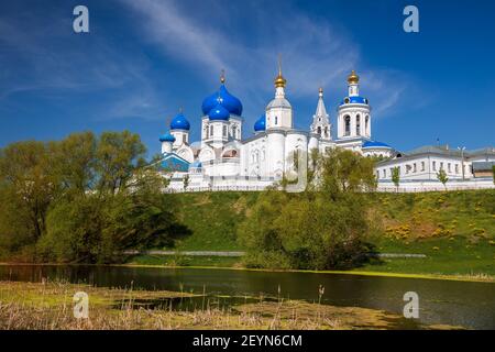 Ancient Holy Bogolyubsky Monastery on high bank of the pond. Bogolyubovo, Vladimir region, Russia Stock Photo