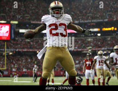 San Francisco 49ers LaMichael James (23) eludes Miami Dolphins