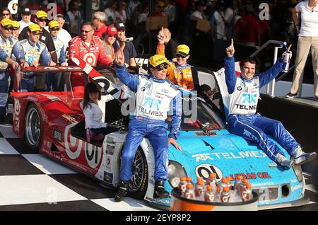 The Chip Ganassi Racing team pushes the car into Victory Lane