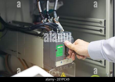 Engineering Hand Off The Power Circuit Breaker Is Installed In The Electrical Cabinet. Stock Photo