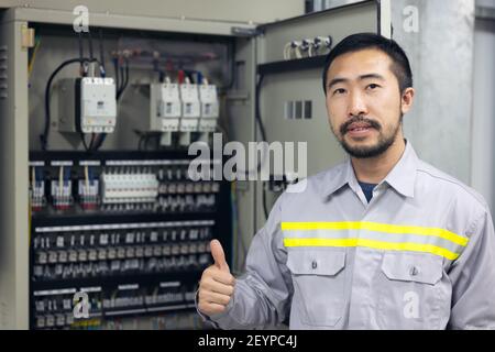 Portrait of engineer Power Systems in factory, industry. Stock Photo