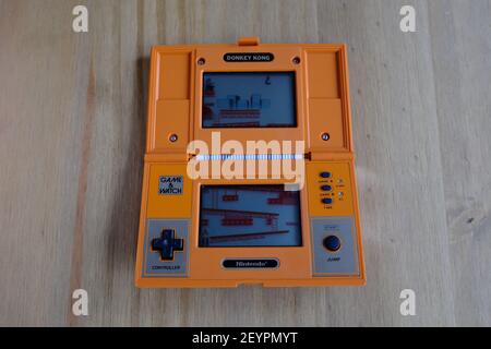 LONDON - 6TH MARCH 2021: The original 1982 Nintendo Game and Watch Donkey Kong handheld games console. Stock Photo