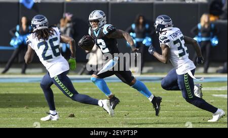 Seattle Seahawks free safety Tedric Thompson, lower left, intercepts a pass  intended for Los Angeles Rams tight end Gerald Everett, right, as outside  linebacker K.J. Wright (50) looks on, during the second