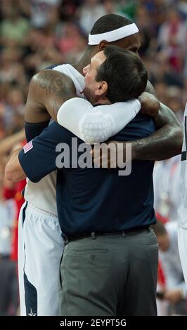 USA's Lebron James (6) gives USA's coach Michael Krzyzewski a big hug following their victory over Spain during their Gold Medal game at the at the North Greenwich Arena during the 2012 Summer Olympic Games in London, England, Sunday, Aug. 12, 2012. USA defeated Spain 107-100. (Photo by Harry E. Walker/MCT/TNS/Sipa USA)
