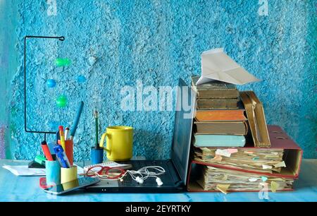 Home office or messy working space of a freelancer working in the Creative Industry Stock Photo