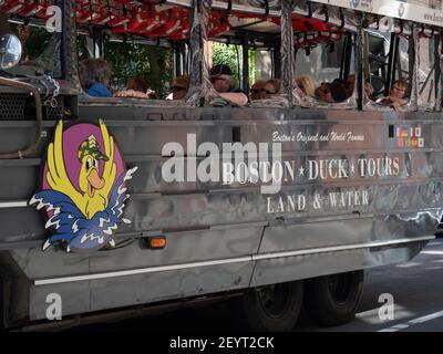 Image of an amphibious vehicle from Boston Duck Tours driving around tourists in downtown Boston. Stock Photo