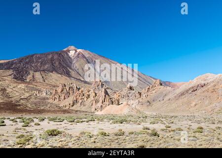 Los Roques de Garcia in front of the Pico del Teide in the caldera of Tenerife, Spain. Stock Photo