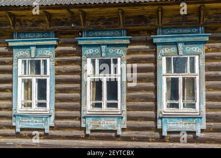 Carved window in old russian wooden country house Stock Photo