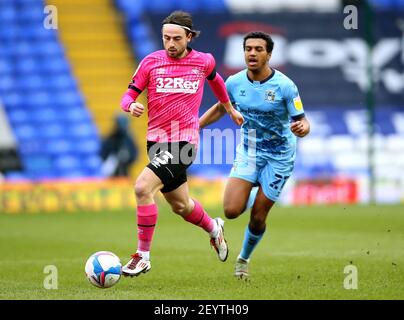 Coventry City's Sam McCallum (right) and Derby County's Patrick Roberts battle for the ball during the Sky Bet Championship match at St. Andrew's Trillion Trophy Stadium, Birmingham. Picture date: Saturday March 6, 2021. Stock Photo