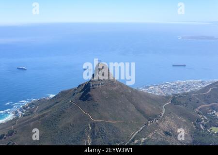 View of Lion's Head peak and Robben island in the distance from the summit of Table Mountain, Cape Town, South Africa Stock Photo