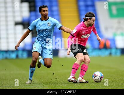 Derby County's Patrick Roberts (right) and Coventry City's Sam McCallum battle for the ball during the Sky Bet Championship match at St. Andrew's Trillion Trophy Stadium, Birmingham. Picture date: Saturday March 6, 2021. Stock Photo
