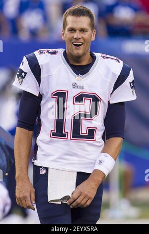 New England Patriots quarterback Tom Brady (12) shakes hands teammate tight  end Aaron Hernandez (85) after Hernandez scored on a ten yard reception  against the Green Bay Packers at Gillette Stadium in