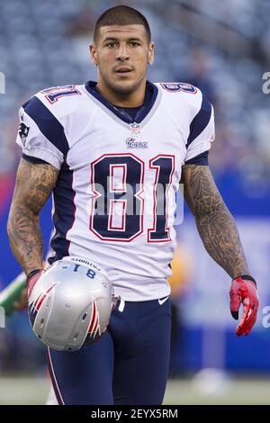 29 August 2012 - East Rutherford, New Jersey - New England Patriots tight  end Aaron Hernandez (81) looks on with his helmet in hand during warm-ups  prior to the NFL preseason game between the New England Patriots and the  New York Giants at