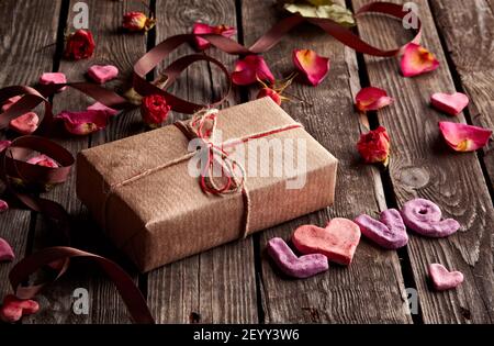 Word Love with gift box on old plates Stock Photo