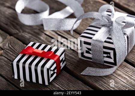 Gift boxes with curved silver ribbon Stock Photo