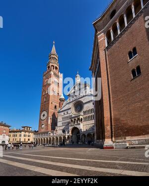 Ancient Cathedral of Cremona with famous Torrazzo bell tower at beautiful market square Piazza Duomo in Cremona, Lombardy, Italy Stock Photo