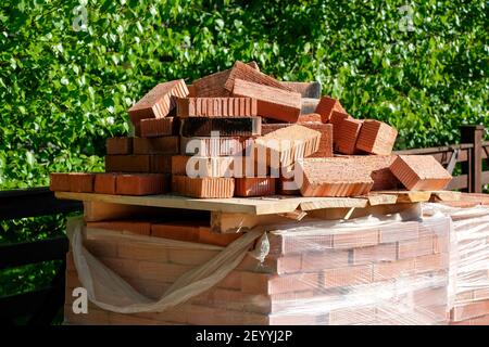 Bricks in the summer at a construction site. Block on the street. Stock Photo