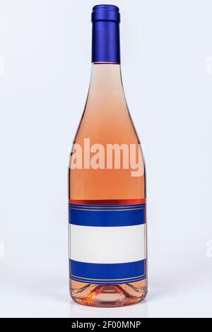 Beautiful burgundy bottle of pinot grigio wine on white surface and background Stock Photo
