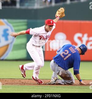Philadelphia Phillies' Chase Utley tries to flip a ball to Jimmy