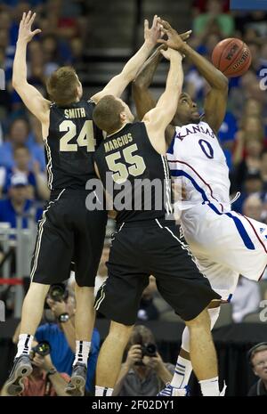 Purdue guard Ryne Smith (24) congratulates teammate Lewis Jackson, right,  during the second half against St. Peter's in the second round of the 2011  NCAA Men's Basketball Championship at the United Center