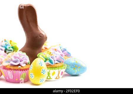 Chocolate Easter Bunny and Cupcakes Isolated on a White Background Stock Photo