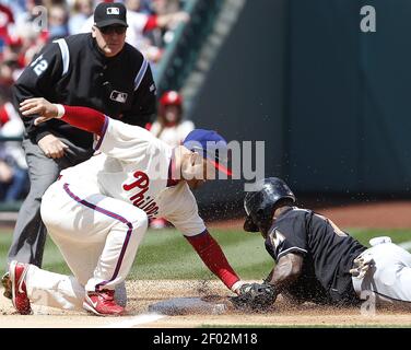 Miami Marlins Jose Reyes motions his team mates after sliding into second  base against the New York Yankees at the new Miami Marlins Ball Park in the  second exhibition game April 2