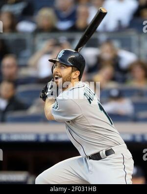 Seattle Mariners' Dustin Ackley connects with a pitch for a double