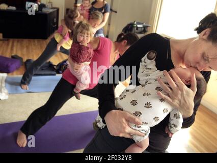 Jessica Gallione gives a tender kiss to her 10 week old daughter