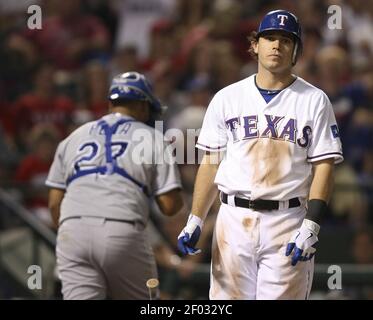 Texas Rangers' Ian Kinsler, right, walks off the field with Rangers manager  Ron Washington, left, after Kinsler's two home runs led the Rangers to a  5-1 win over the Seattle Mariners in